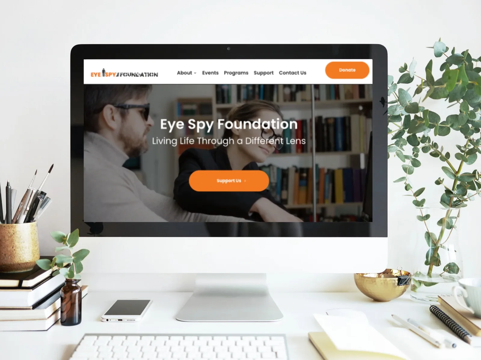 The Eye Spy Foundation website homepage displayed on a desktop monitor