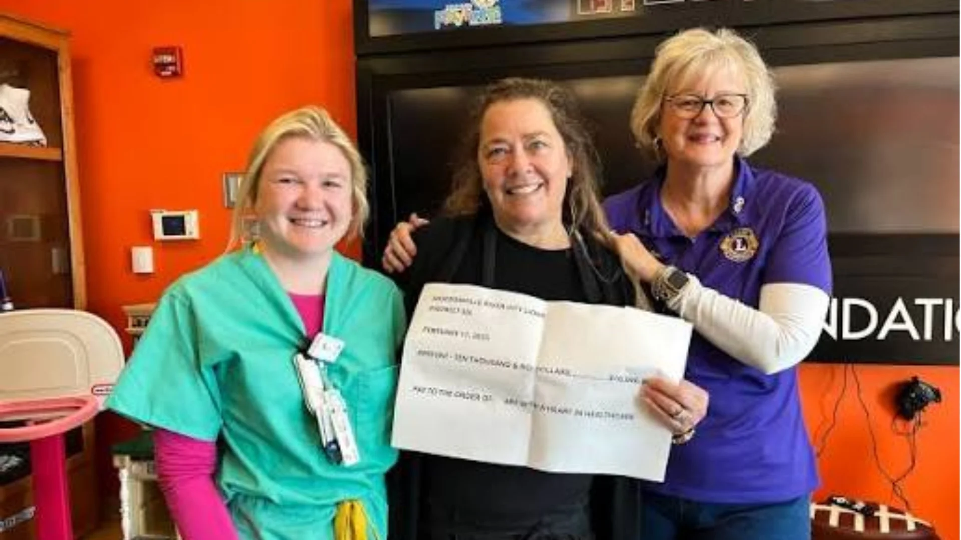 Jacksonville River City Lions Club members presenting a donation check at a community service event